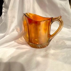 Amber carnival glass pitcher